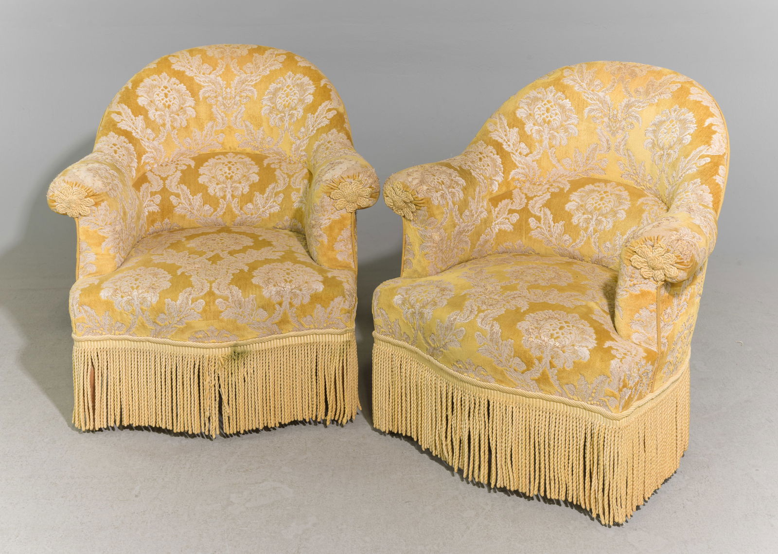 French Pair of Gold Upholstered Crapeau Chairs: French Pair of Gold Upholstered Crapeau / Boudoir Chairs with Fringed Skirts - 31 in tall x 31 x 27 each with a seat height of 15 inches