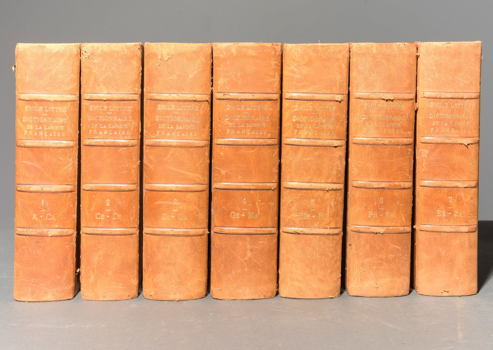 Vol. 1-7 Leather Bound "Emile Littre" Dictionaire Books: Vol. 1-7 Leather Bound "Emile Littre" Dictionaire Books - 10.75 in tall x 5.5 x 3