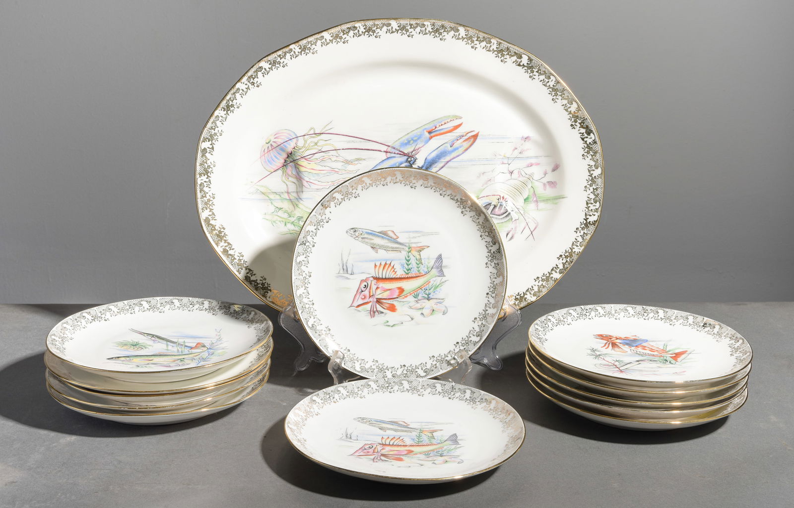 13pc Fish / Lobster Plate Set - Platter & 12 Plates: 13pc French Exotic Fish / Lobster Plate Set - Platter & 12 Plates - Platter is 1.75 in tall x 18.25 x 14.5, Plates are 1 in tall x 9.25 inch diameter each