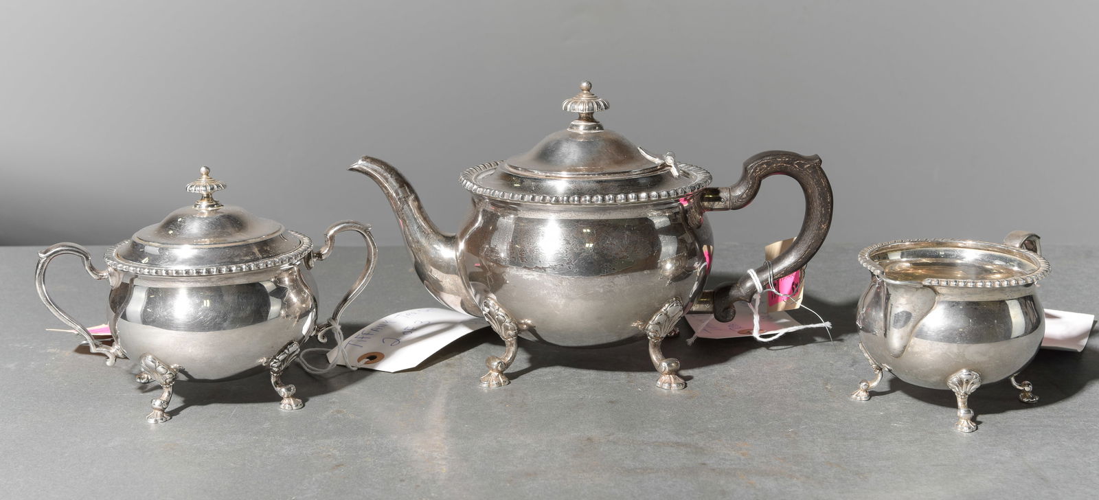 3 Piece Sterling Silver Tiffany Tea Set: 3 Piece Silver Tea Set marked Tiffany & Co. - Total Weight is 58.3 OZT, weight includes the handles - 6.25 in tall x 10.5 x 5.5, 4.75 in tall x 6.5 x 4.75, 3 in tall x 5.25 x 3.75