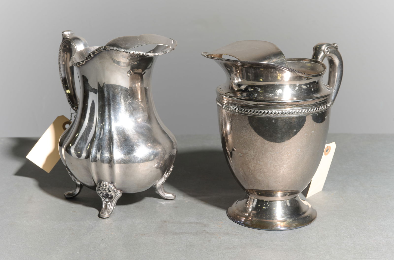 Two Silverplate Lancaster Rose Pitchers: Two Silverplate Lancaster Rose Pitchers - 9.5 in tall x 6 x 10