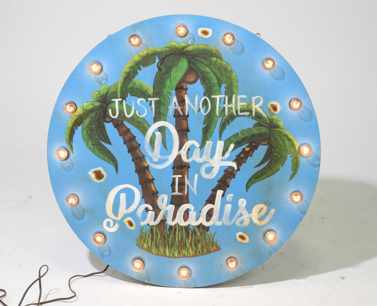 "Just Another Day In Paradise" Light Up Sign: "Just Another Day In Paradise" Light Up Metal Sign - 39.5 inch diameter with a 3.5 inch depth