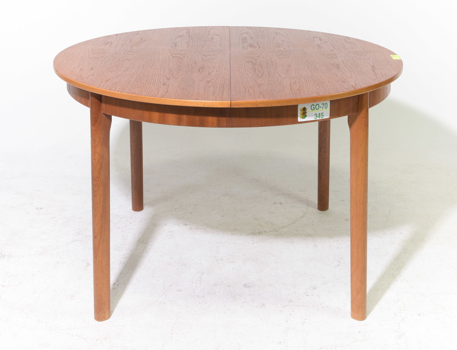 Mid Century Modern Round Table with Pop Up Leaf: Danish Modern Style Round Dining Table with Pop Up / Butterfly Leaf - 29 in tall x 45 inch diameter, Leaf adds an additional 17 inches, floor to apron is 24.75 inches and the space between the legs is