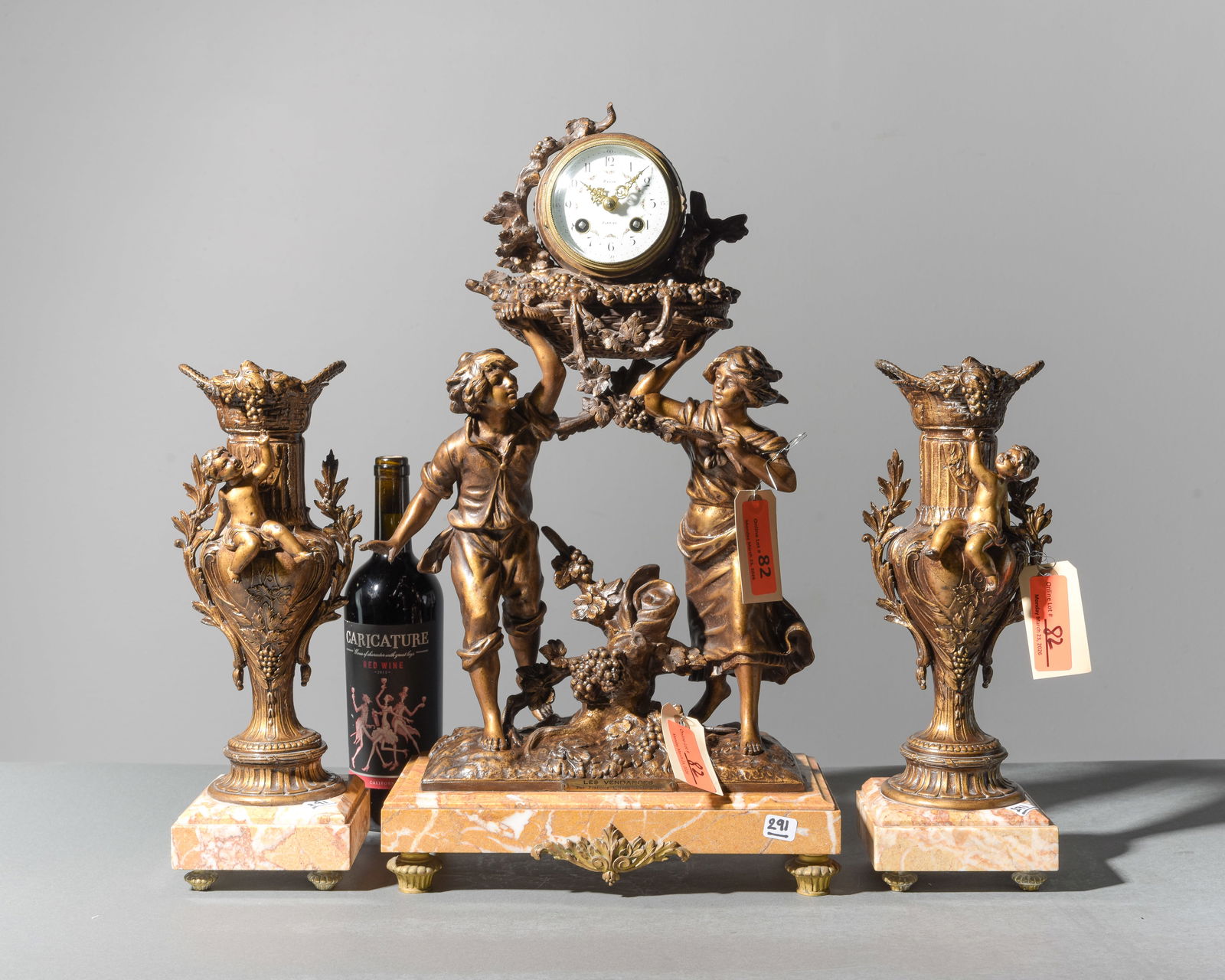 3pc French Spelter Figural Clock on Marble Base: 3pc French Spelter Figural Clock on Marble Base with Garnitures - 22 in tall x 16 x 6.5 and 14.75 in tall x 5.5 x 4.5 each - This is signed