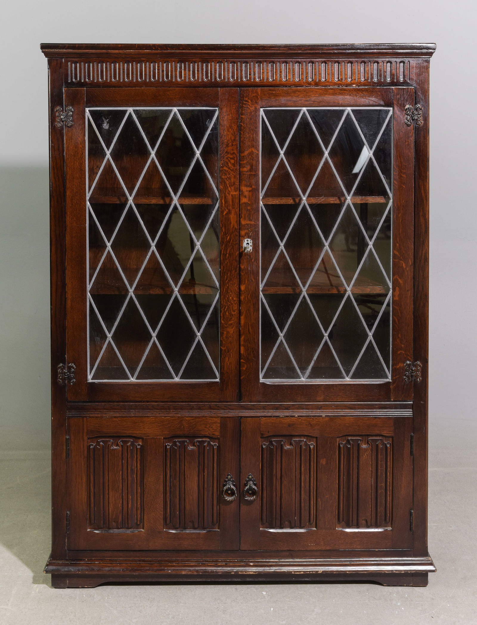British Oak Leaded Glass Bookcase / Cabinet: British Oak Leaded Glass Bookcase / Cabinet with Linen Fold Paneling - 54 in tall x 38 x 12