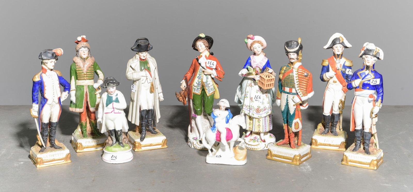 10 Assorted Porcelain Figures / Soldiers: 10 Assorted Porcelain Figures / Soldiers - The two largest are 10 in tall x 3 x 2.5 and 9.5 in tall x 4.5 x 2.5