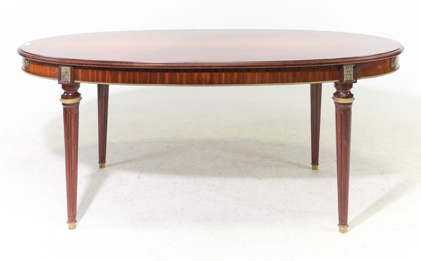 Louis XVI Style Oval Mahogany Table with 2 Leaves: French Louis XVI Style Oval Mahogany Table with 2 Leaves - 30 in tall x 72 x 42, Leaves add an additional 20 inches each, Floor to apron is 25.75 inches and the space between the legs is 42.5 inches