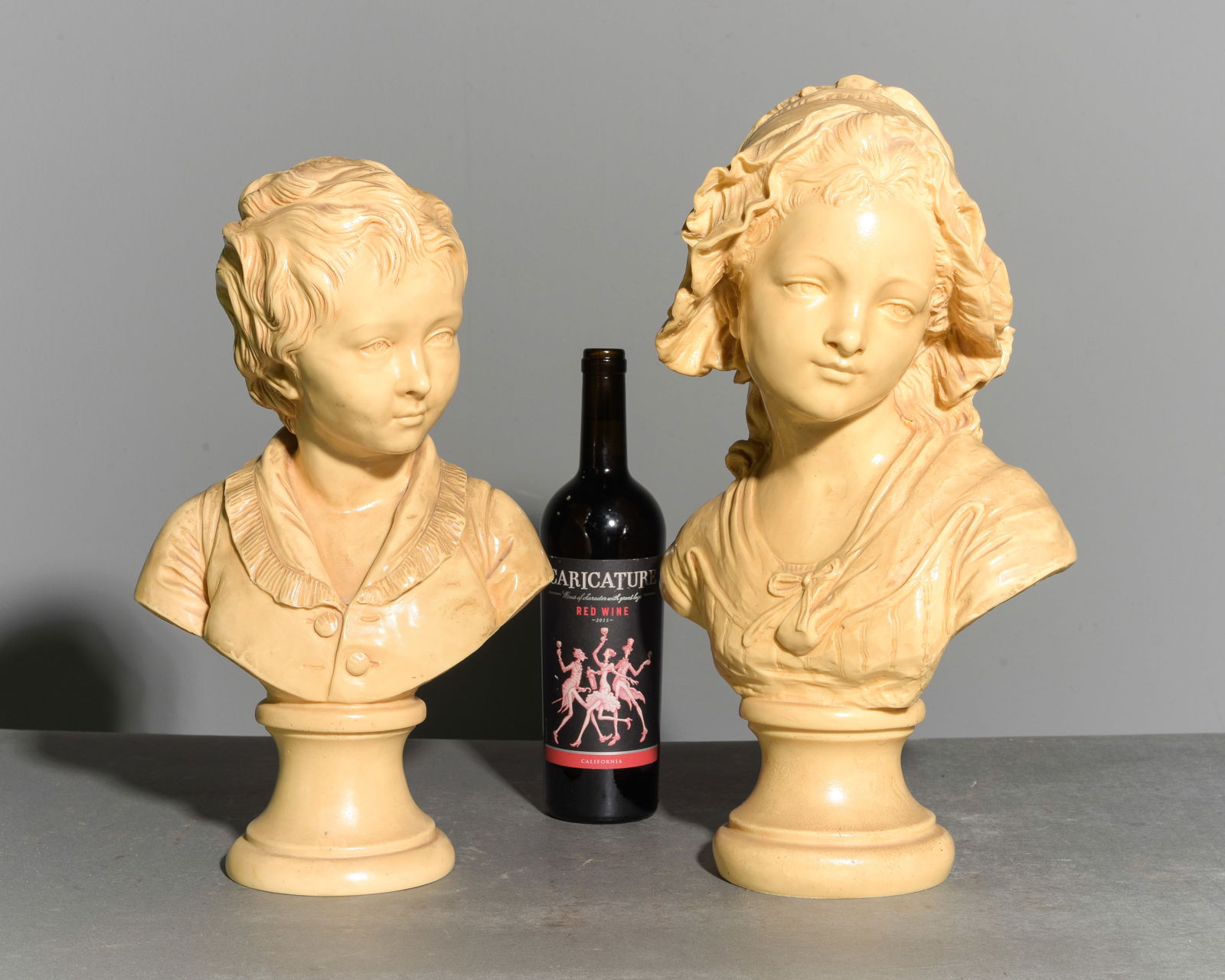 2 French Heavy Busts - Grinham Niam of Paris: 2 French Heavy Busts - One is of a peasant girl signed Grinham Niam of Paris and the other is of a young boy signed Jean-Antoine Houdon - 18 in tall x 11 x 8 and 16 in tall x 10.5 x 7