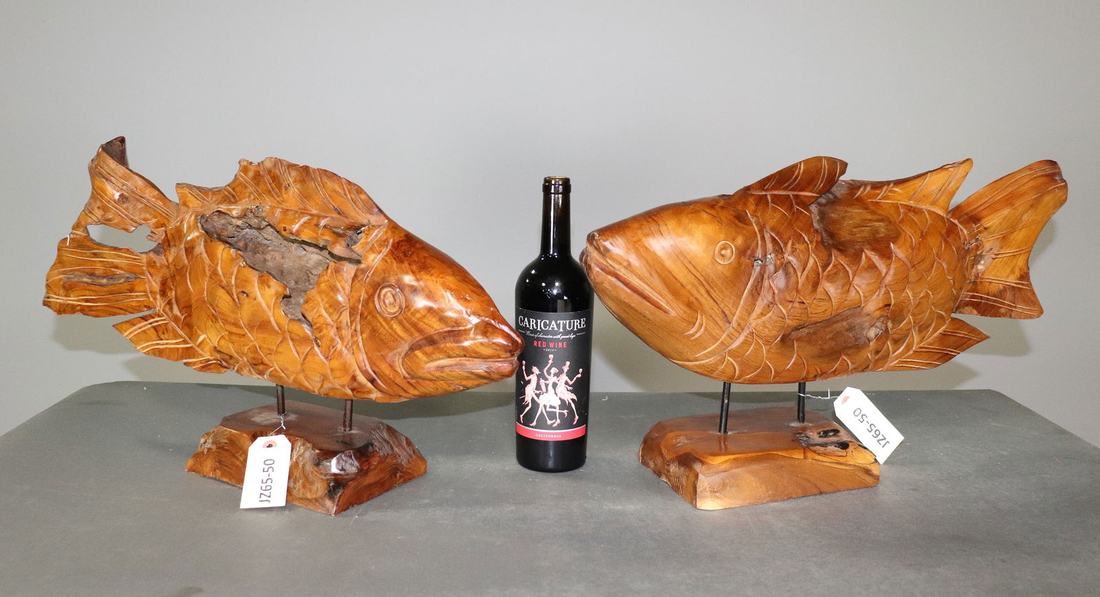 Two Teak Fish Figures on Wooden Stand: Two Teak Fish Figures on Wooden Stand - Largest is 13 in tall x 24 x 5.5