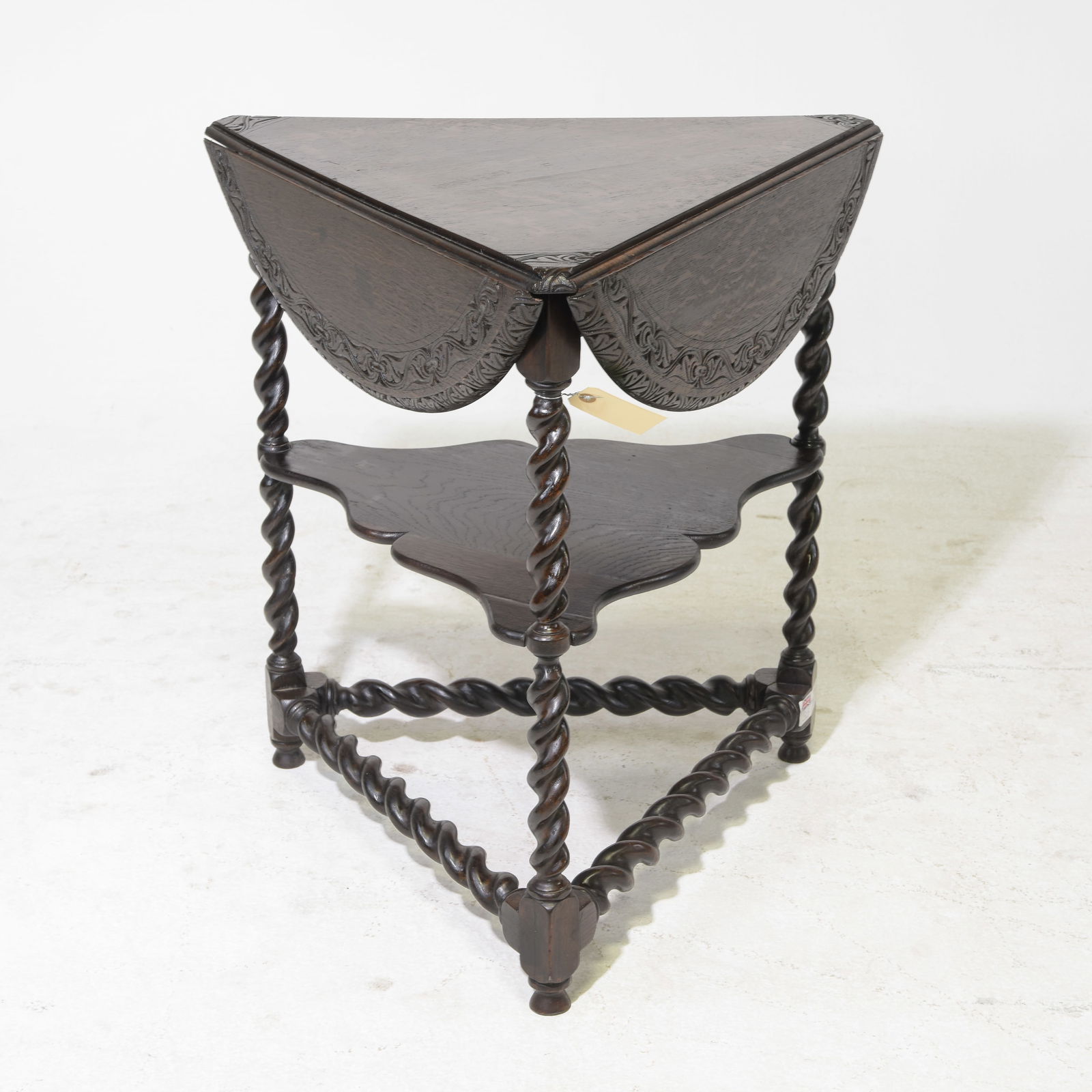 British Carved Oak Barley Twist Drop Sided Corner Table: British Carved Oak Barley Twist Drop Sided Corner Table - When leaves are in use this is 28 in tall x 30 inch diameter. When the leaves are down this is 28 in tall x 27 x 24