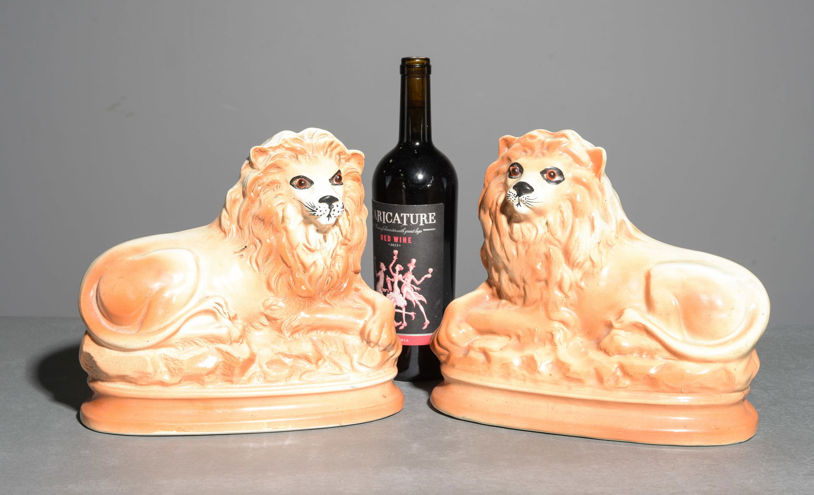 Pair of Staffordshire Lions with Glass Eyes: Pair of Staffordshire Lions with Glass Eyes - 9.5 in tall x 11 x 5.75 each