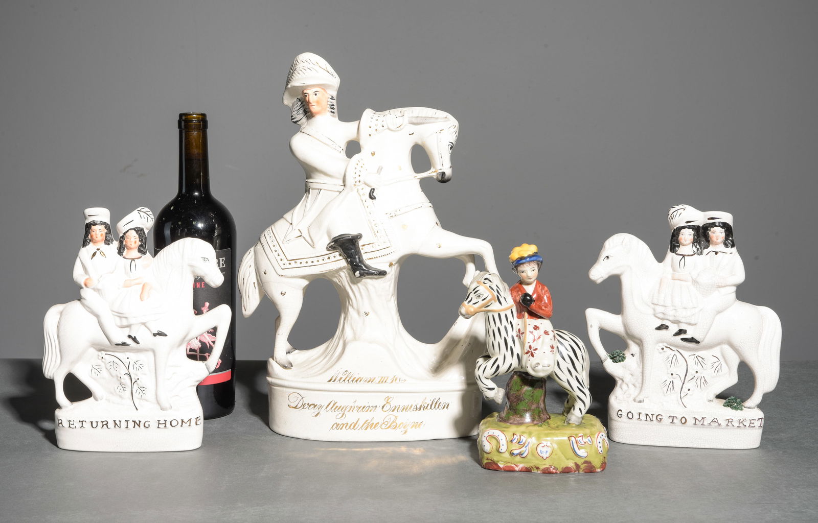 Four Assorted Staffordshire Figures: Four Assorted Staffordshire Figures - Largest is 14 in tall x 10.25 x 3.5