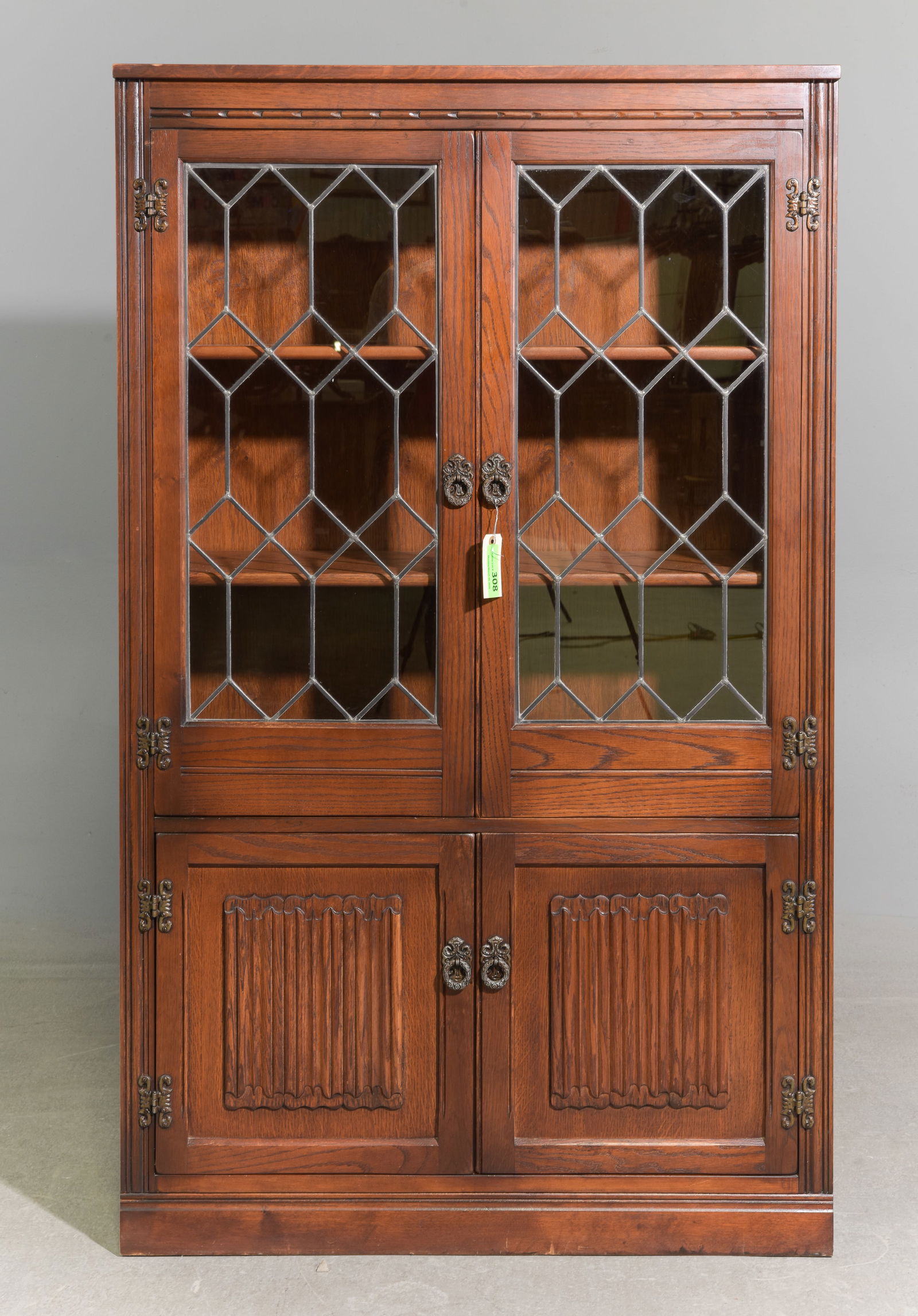 British Oak Leaded Glass Bookcase c.1930's-40's: British Oak Leaded Glass Bookcase with Linen Fold Paneling c.1930's-40's - 60 in tall x 36 x 12.75