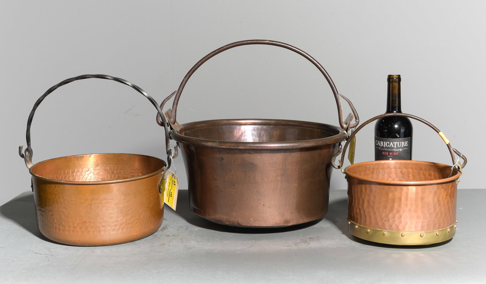 3 Assorted French Copper Pots with Iron Handles: 3 Assorted French Copper Pots with Iron Handles - 9 in tall x 16.5 x 14.75, 6.75 in tall x 12.5 x 10.5, 6 in tall x 10 x 8.5