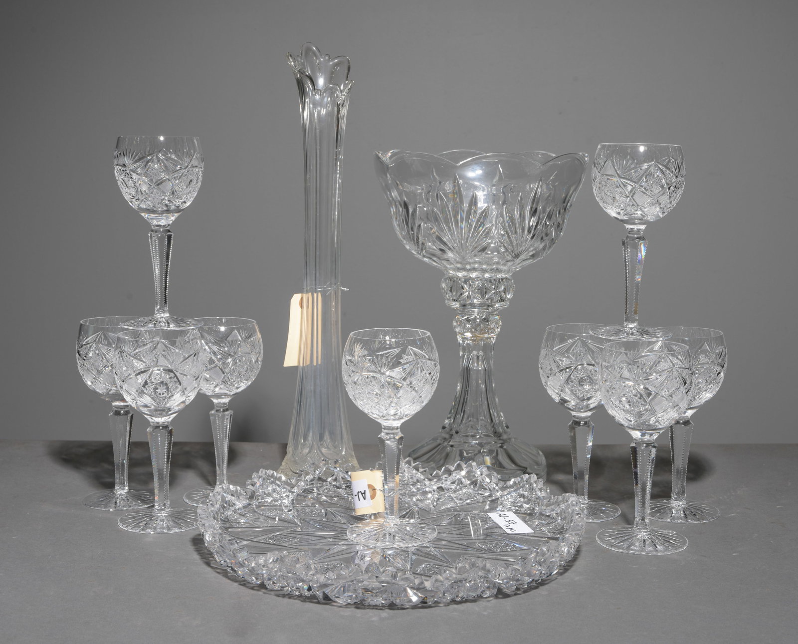 12pc- American Brilliant Cut Glass Platter, Stems, Etc.: 12pcs - American Brilliant Cut Glass Platter with Saw Tooth Edge, 9 Stems, Etc. - Platter is 1.75 in tall x 12.75 inch diameter