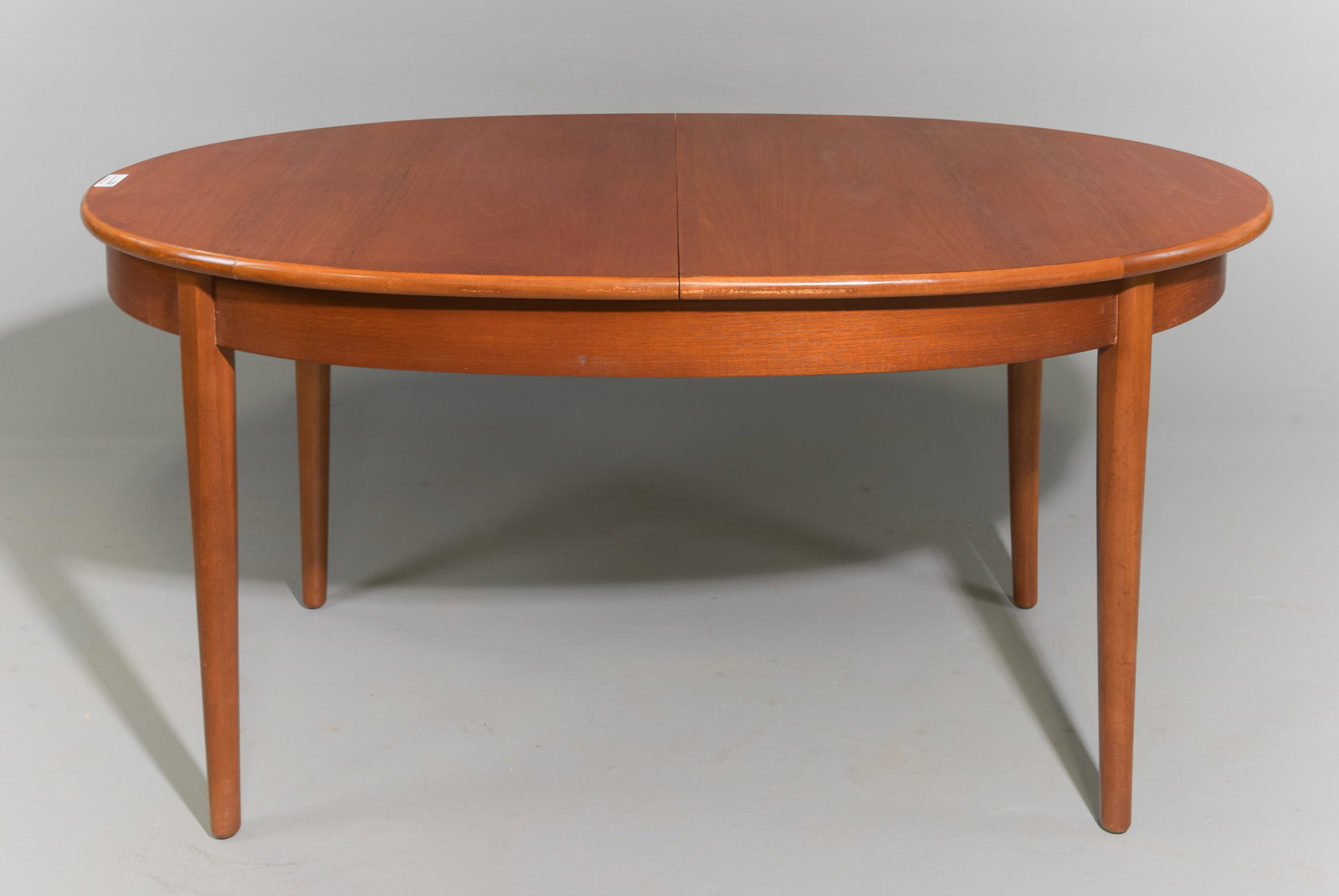 Mid Century Modern Oval Table with Pop Up Leaf: Danish Modern Style Dining Table with Butterfly / Pop Up Leaf - 28.75 in tall x 60.25 x 36, Leaf adds an additional 18 inches, Floor to apron is 23.75 inches and the space between the legs is 39.5 inc