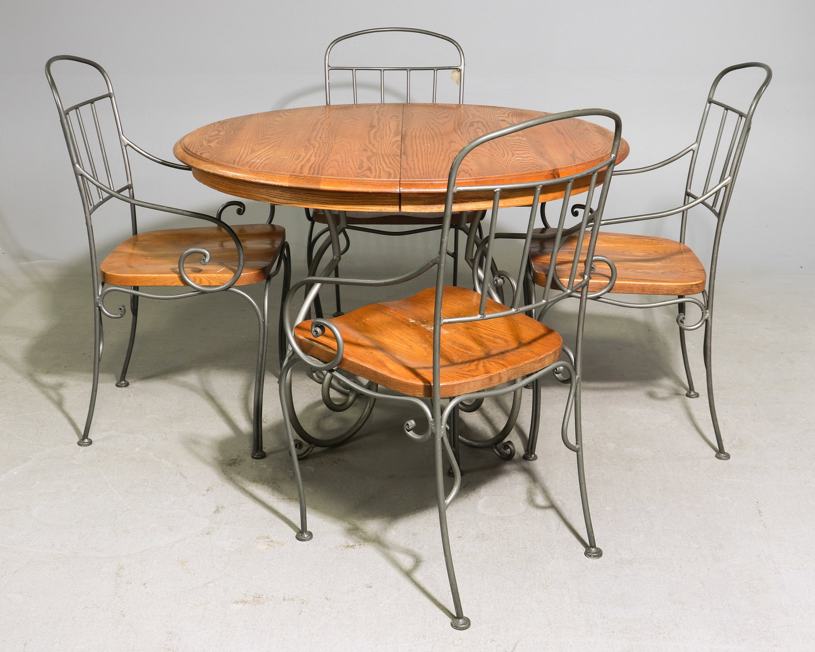 Kincaid Oak & Metal Round Table with 4 Chairs: Kincaid Oak & Metal Round Table with 4 Chairs - 30 in tall x 44 inch diameter, Leaf adds an additional 18.5 inches, Chairs are 37 in tall x 21 x 21 each with a seat height of 18 inches