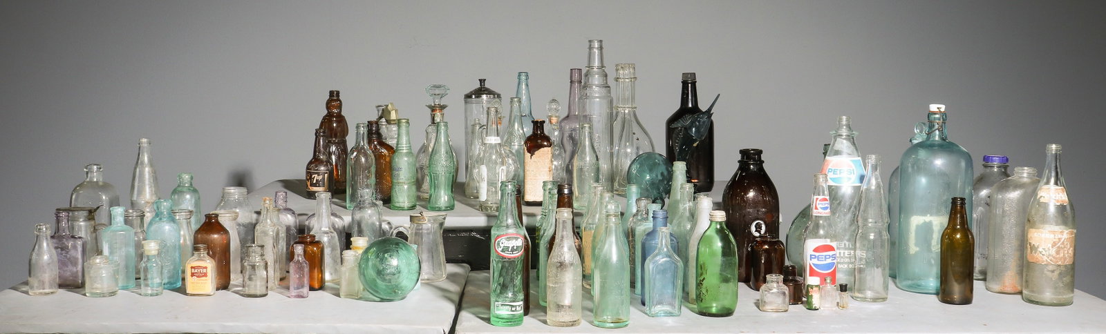 93 Assorted Vintage Glass Soda Bottles, Etc.: 93 Assorted Vintage Glass Soda Bottles, Etc. - Tallest is 14.5 in tall x 5.5 inch diameter