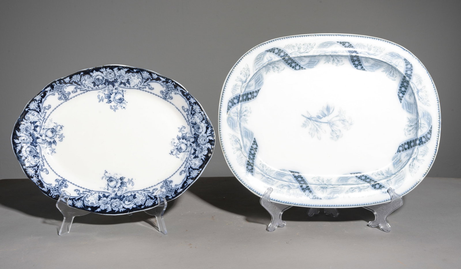 Two British Flo Blue & White Platters: Two British Flo Blue & White Platters - 1.25 in tall x 17.25 x 13.5 and 1.75 in tall x 15.75 x 11.75 - One is marked "Belmont" Hanley England