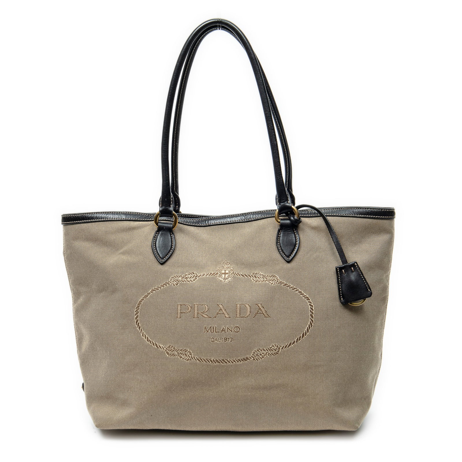 Prada Jacquard Tote in Beige/Black Jacquard Canvas: Genuine Pre-Owned Prada Jacquard Tote in Beige/Black Jacquard Canvas made in Italy in A condition. Date Code is 204 Measurements: 30*25*15cm (Length * Height * Width). This lot includes a certificate 