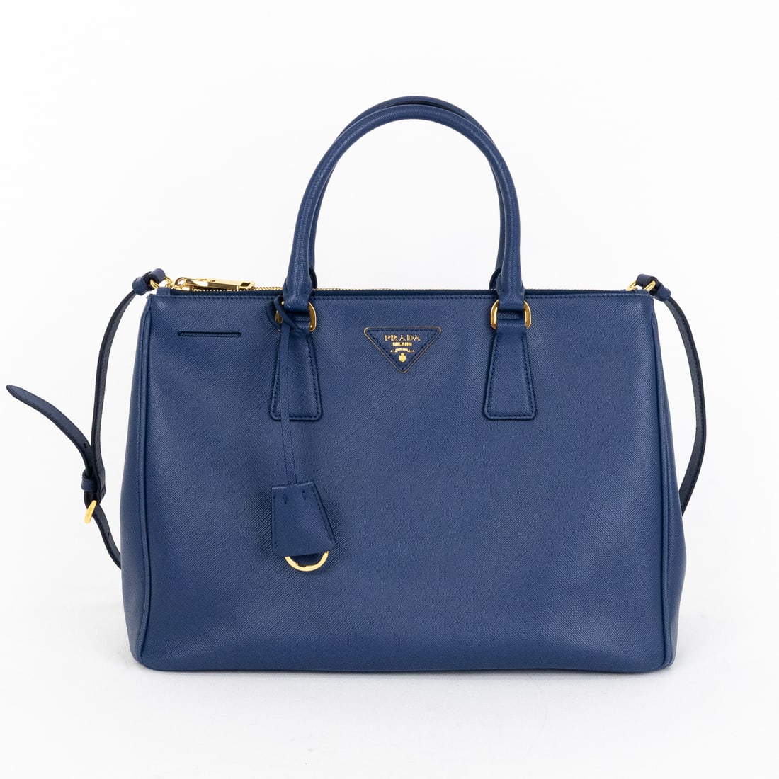 Prada Double Zip Galleria Tote Medium in Blue Saffiano: Genuine Pre-Owned Prada Double Zip Galleria Tote Medium in Blue Saffiano Lux Leather made in Italy in AA condition. Date Code is 165 Measurements: 33.5*23*14.5cm (Length * Height * Width). This lot in
