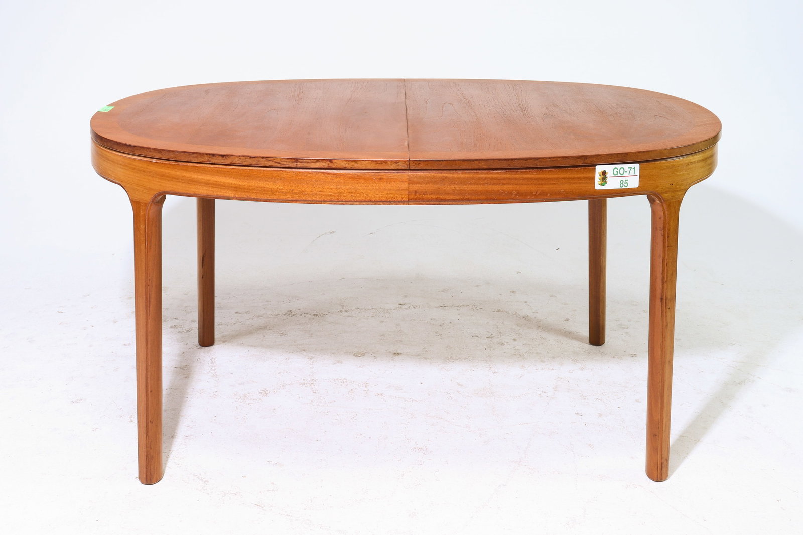 Oval Mid Century Modern Teak Dining Table By Nathan: This Danish Modern Style Teak Dining Table includes a pop-out butterfly style leaf & is made by Mid Century Modern Furniture Maker Nathan. - 29.5 in tall x 60 x 39, Leaf adds an additional 21 inches, 