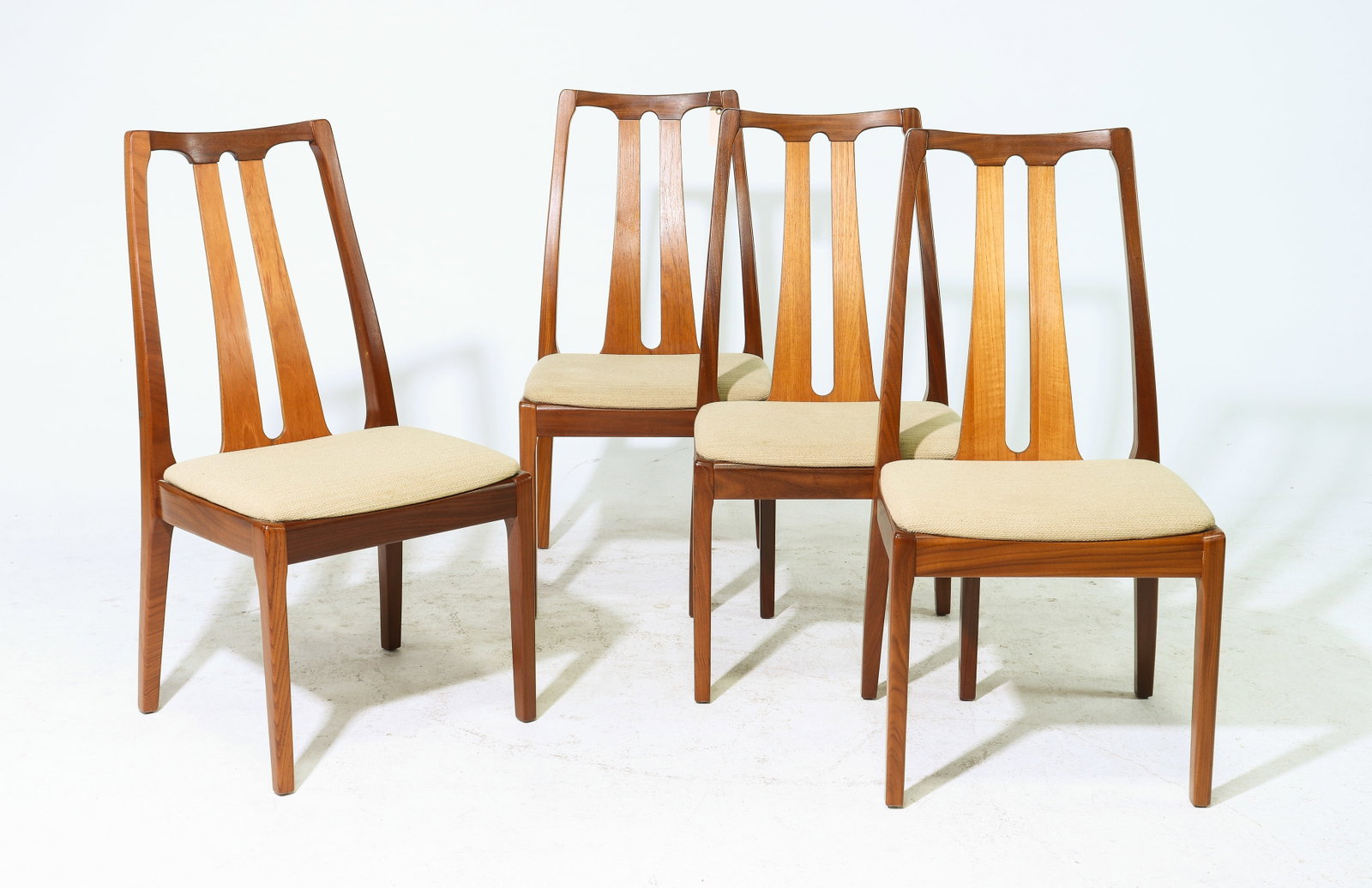 4 Mid Century High Back Dining Chairs By Nathan: This set of Danish Modern Style Teak Dining chairs is made by Mid Century Modern Furniture Maker Nathan. - 38 in tall x 19 x 20 each with a seat height of 18 inches