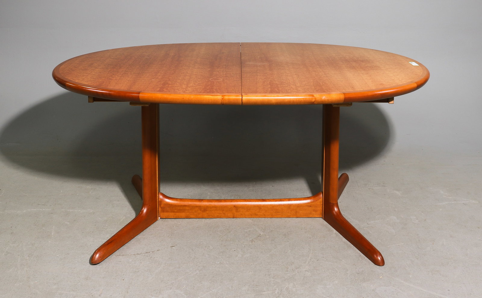 Danish Oval Dining Table with Two Leaves: Danish Mid Century Modern Oval Dining Table with Two Leaves attributed to Skovby - 28.75 in tall x 64.5 x 40.5, Leaf adds an additional 19.75 inches, Floor to apron is 26.75 inches and the space betwe
