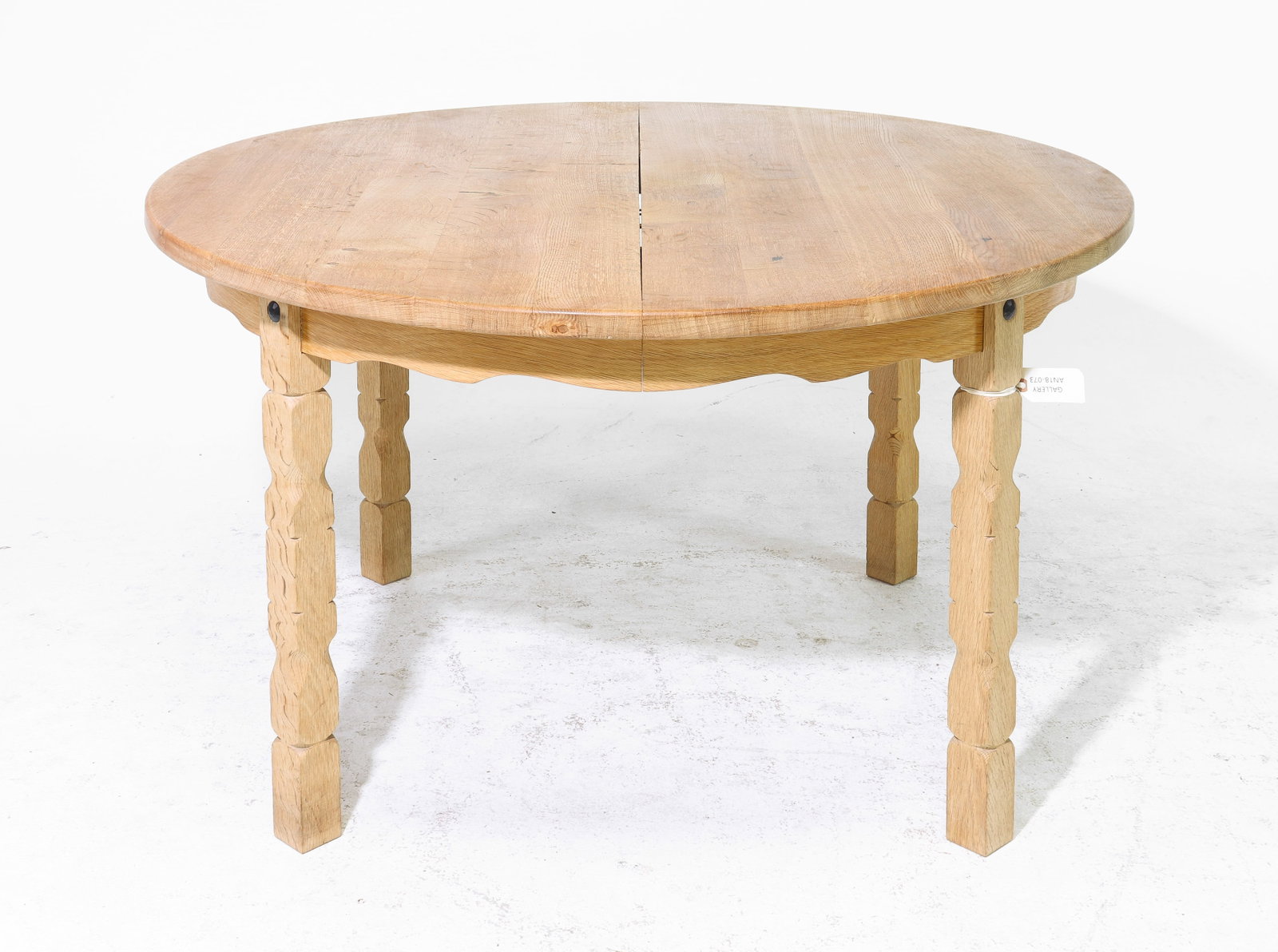 Danish Oak Round Table with Three Insertable Leaves: Danish Oak Round Table with Three Insertable Leaves - 28.5 in tall x 48.5 inch diameter, Leaves add an additional 19.75 inches each, Floor to apron is 23.75 inches and the space between the legs is 26