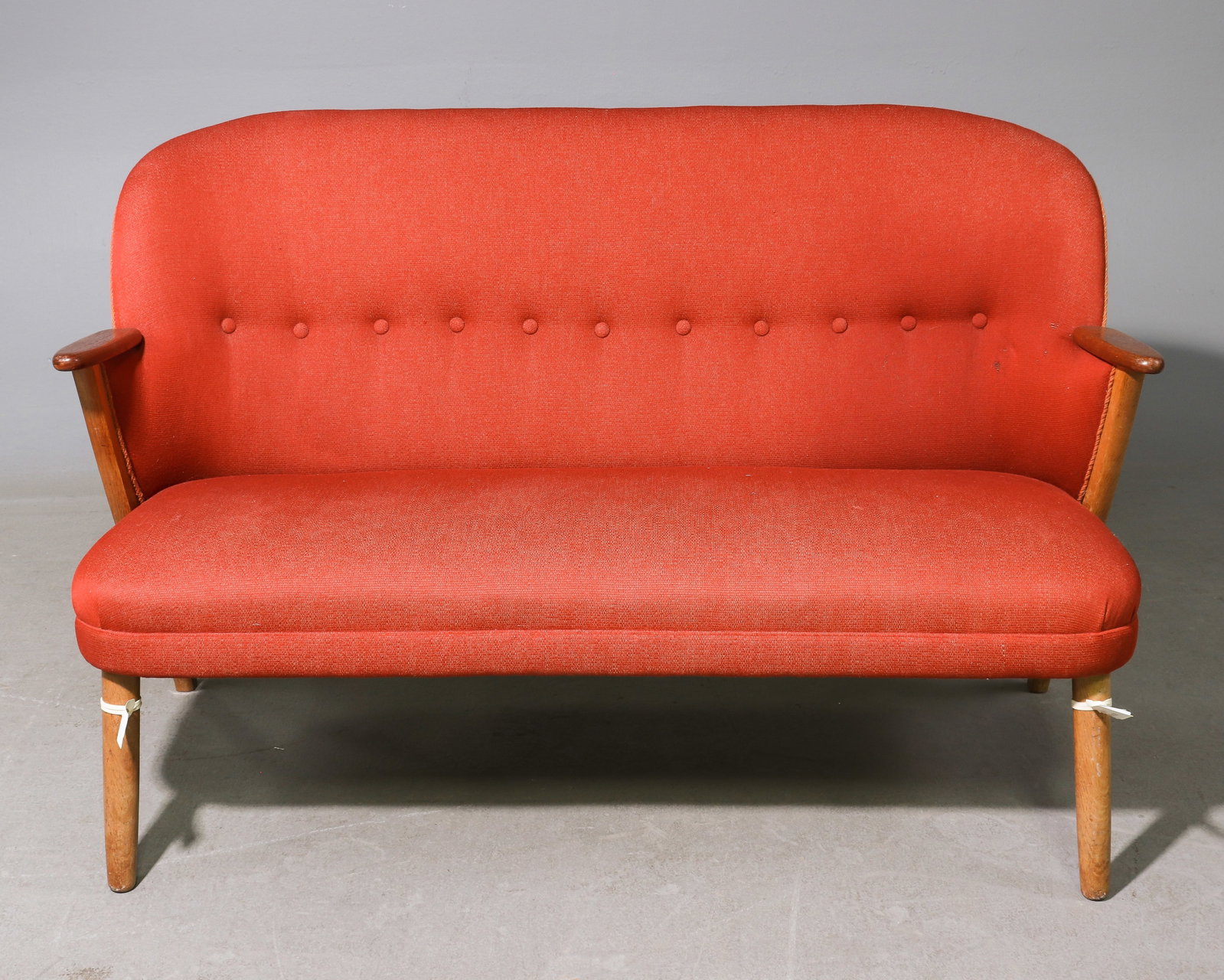 Danish Mid Century Modern Red Upholstered Settee: Danish Mid Century Modern Red Upholstered Settee / Sofa - 32 in tall x 51.5 x 28 with a seat height of 17.5 inches