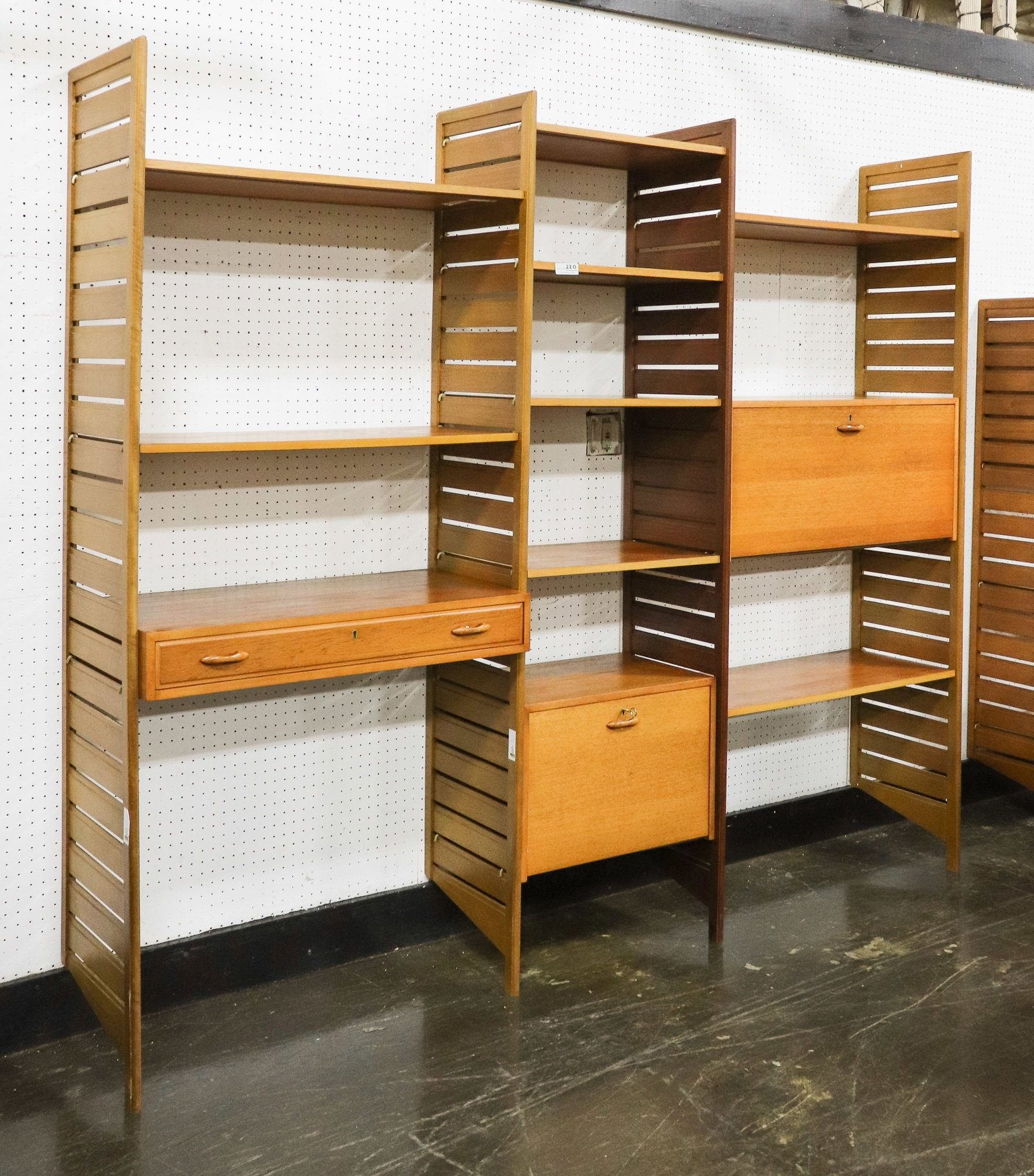 3 Bay Mid Century Wall Unit / System By Ladderax: 3 Bay Danish Modern Style Mid Century Modern Wall Unit / System by Ladderax - Consists of 4 Wood Sides, 8 Shelves, 2 Drop Down Boxes, 1 Single Drawer Desk & Key - 79 in tall x 98 x 17 as shown. CAN BE