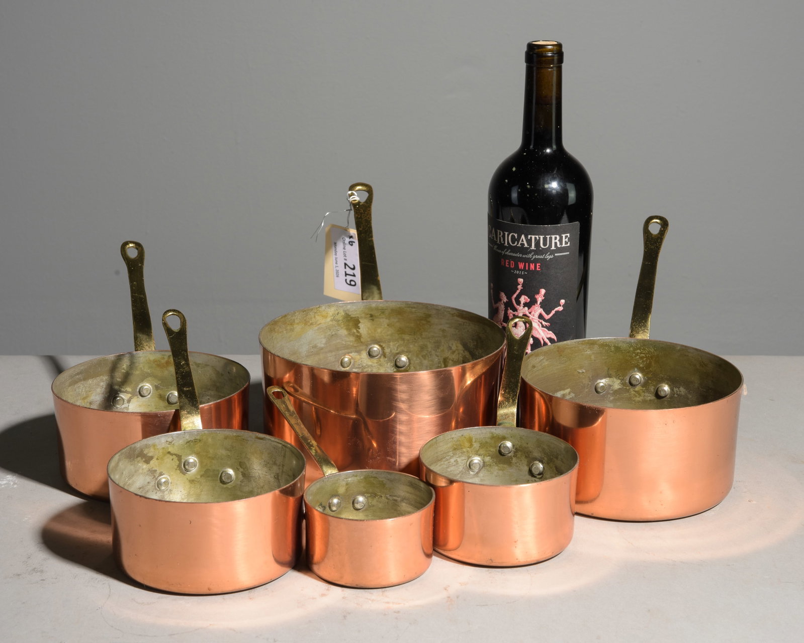 Six French Copper Sauce Pans with Brass Handles: Six French Copper Sauce Pans with Brass Handles - Largest is 6 in tall x 7 x 14