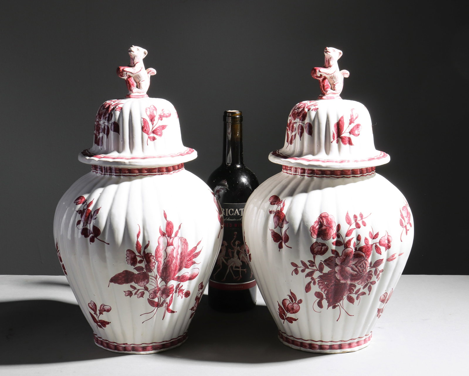 French Pair of Urns with Floral Motif: French Pair of Urns with Floral Motif - 16 in tall x 8.5 inch diameter each