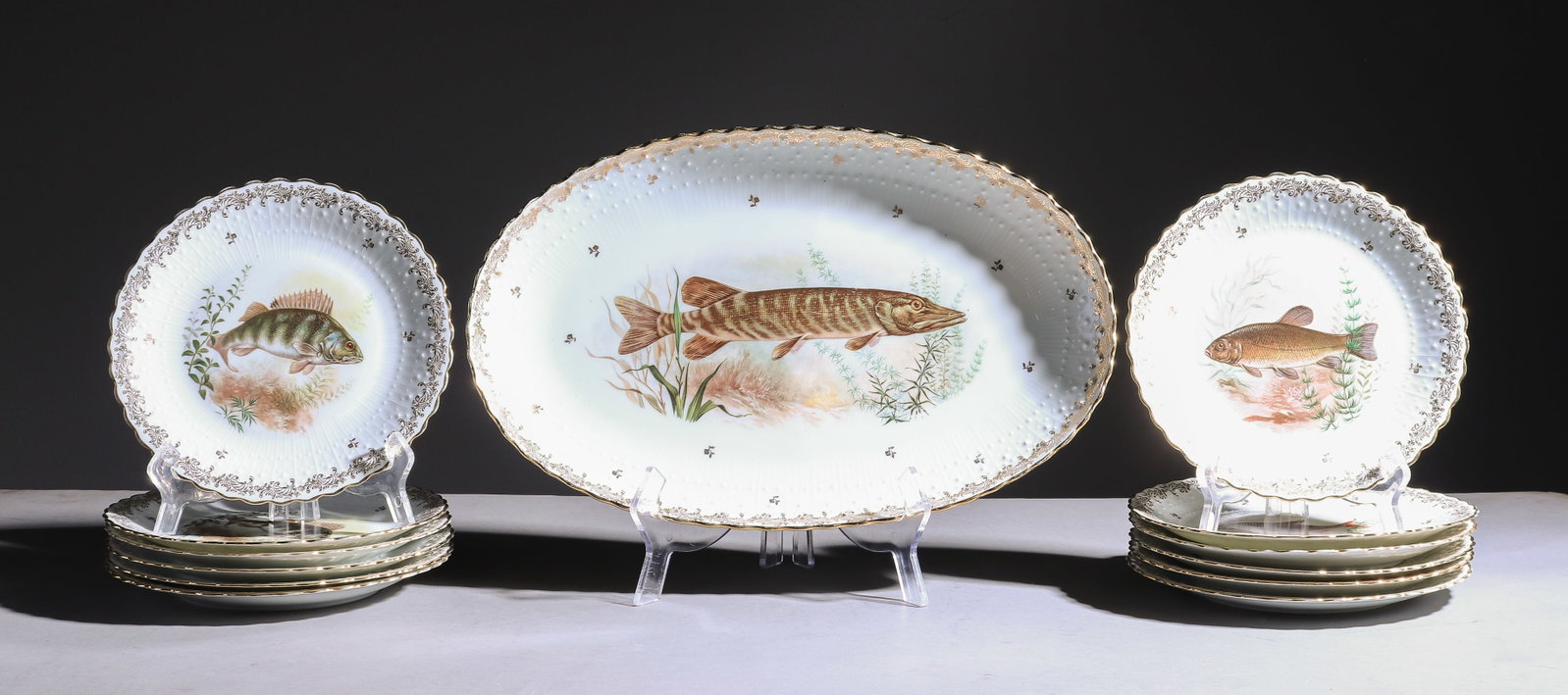 13pc French Fish Plate Set - Platter & 12 Plates: 13pc French Fish Plate Set - Platter & 12 Plates - Platter is 2 in tall x 16.5 x 10, Plates are 1 in tall x 8.5 inch diameter
