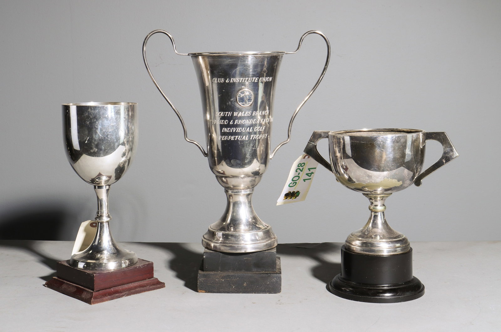 Three Assorted British Silverplate Trophies: Three Assorted British Silverplate Trophies - 17 in tall x 12 x 6, 10.5 in tall x 10.5 x 6 and 12 in tall x 5.5 inch diameter