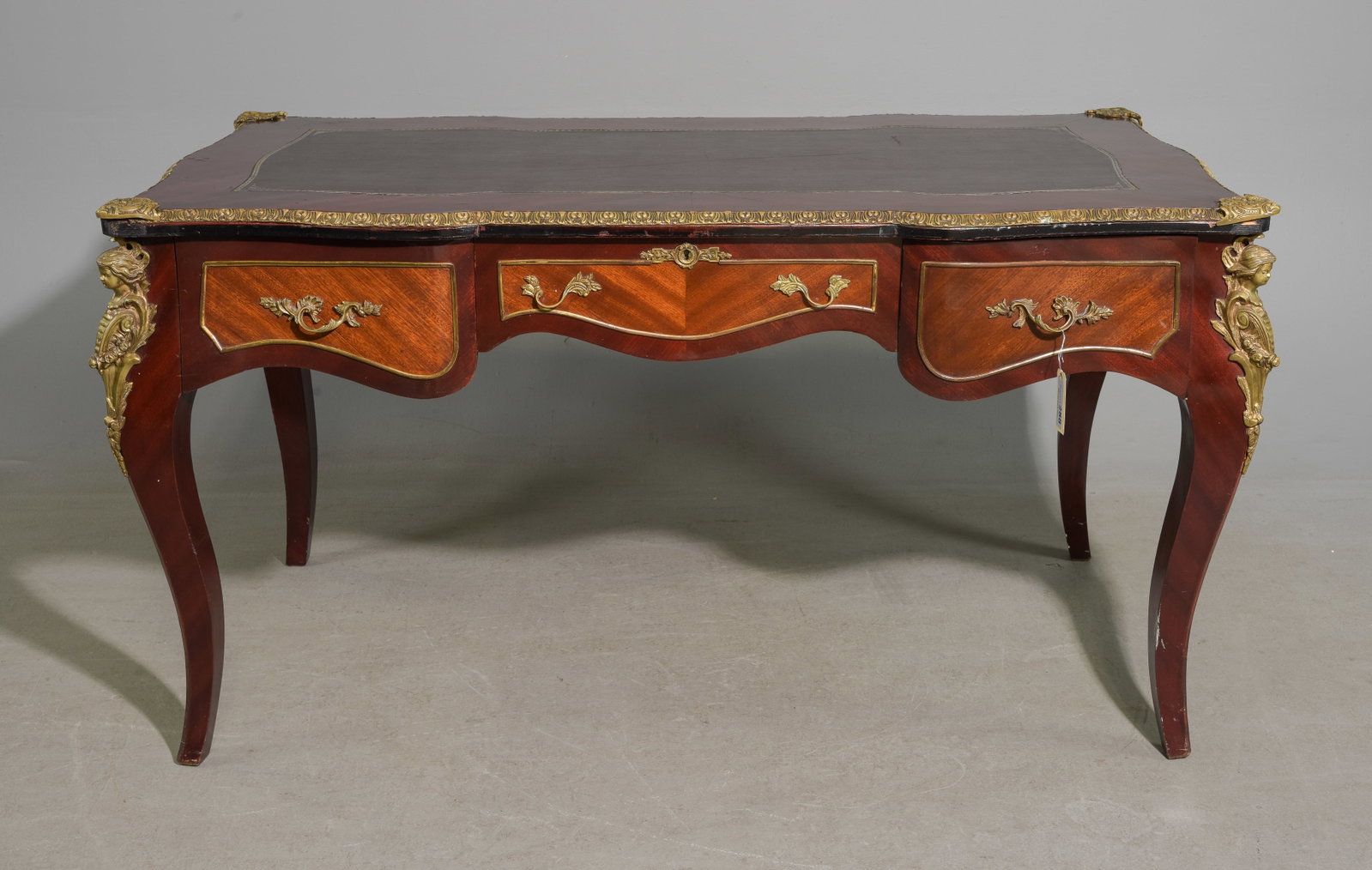 Empire Style Mahogany Leather Top Desk: Empire Style Mahogany Leather Top Desk with Gilded Ormolu Adornments - 32 in tall x 61 x 32, Floor to under is 24 inches and the space between the legs is 51.5 inches