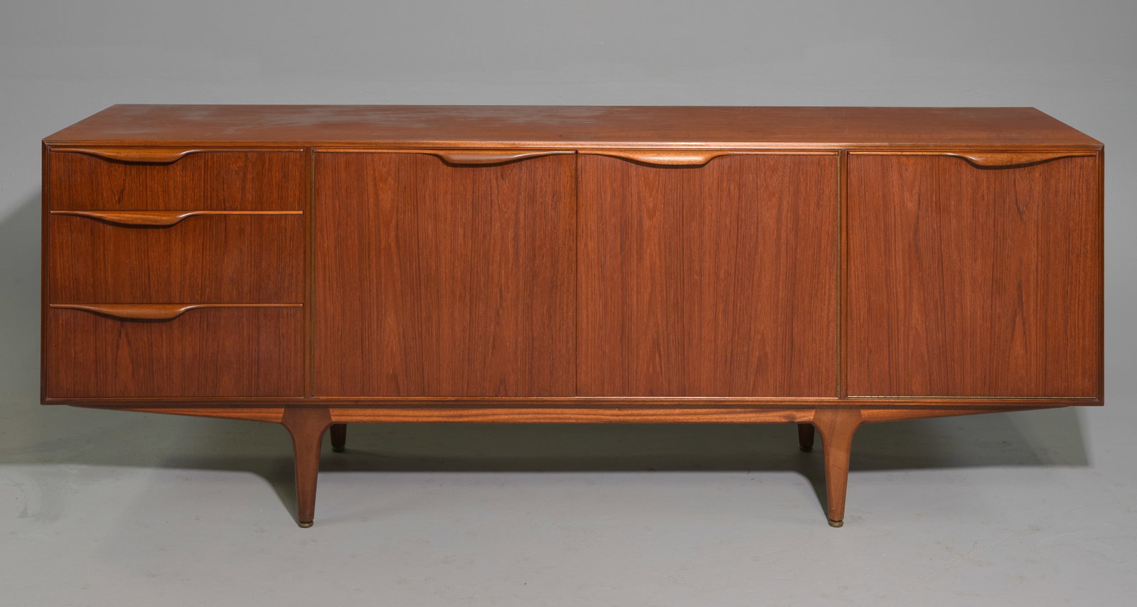 Mid Century Sideboard - Mcintosh - "Dunvegan": This Danish Modern Style Teak Credenza / Cocktail Sideboard with folded handles & pull out tray is made by Scottish Mid Century Modern Furniture Maker McIntosh. It was designed by Tom Robertson, it