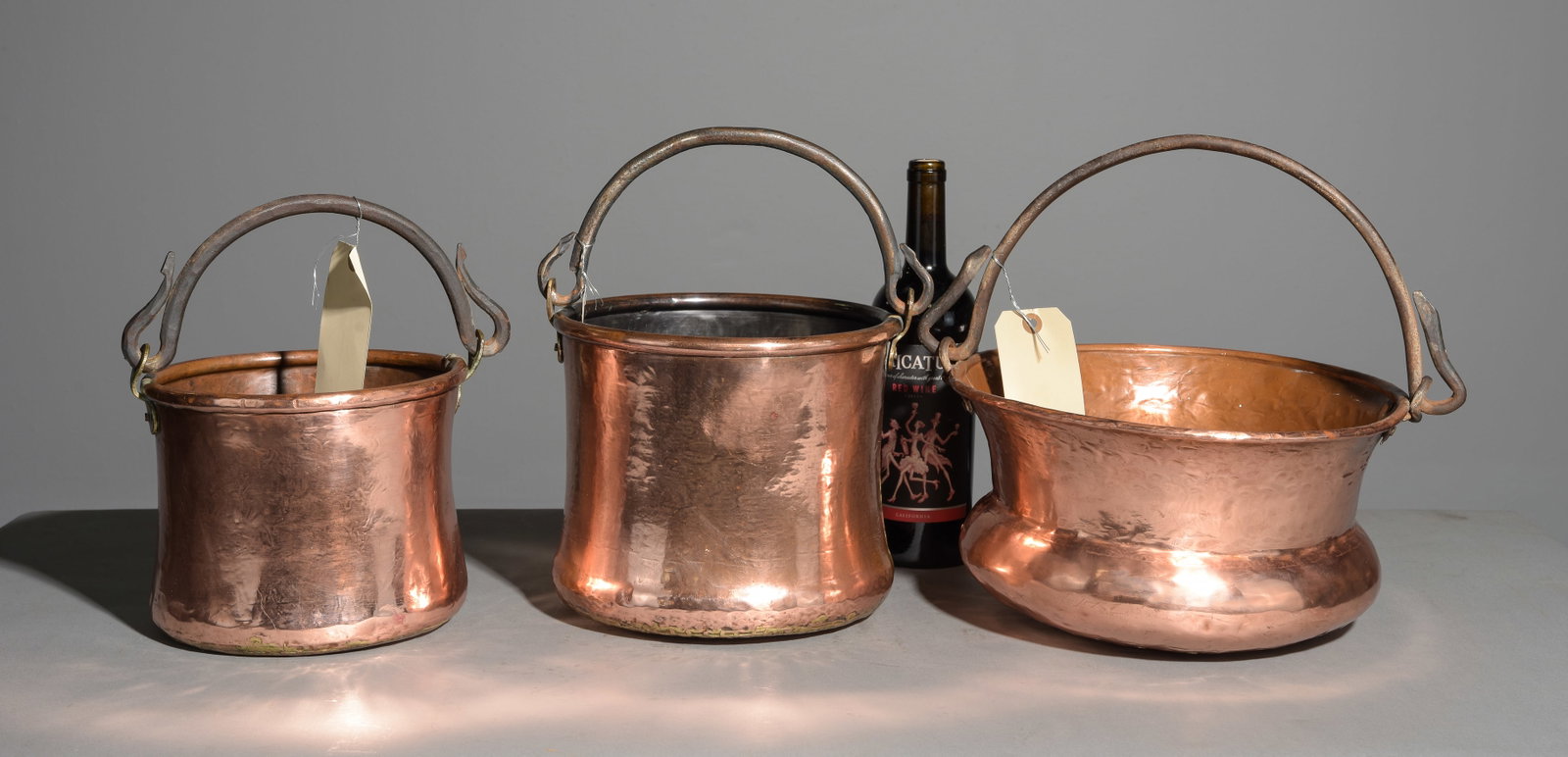 Three French Polished Copper Pots with Iron Handles: Three French Polished Copper Pots with Iron Handles - 9 in tall x 11 x 9.5, 8 in tall x 10.5 x 8.5 and 7 in tall x 14.5 x 12.5