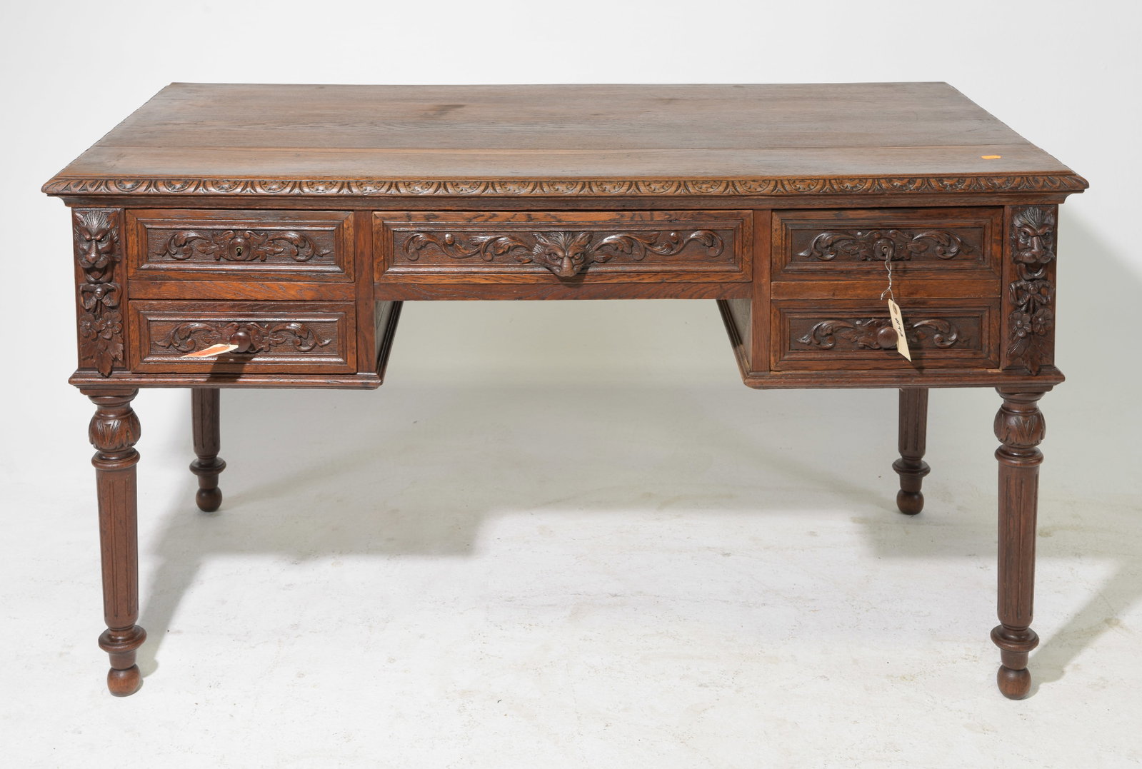 Henri II Style Carved Oak Desk with Turned Legs: French Henri II Style Carved Oak Desk with Turned Legs - 30 in tall x 54 x 29.5, kneehole is 23 in x 19.5 in
