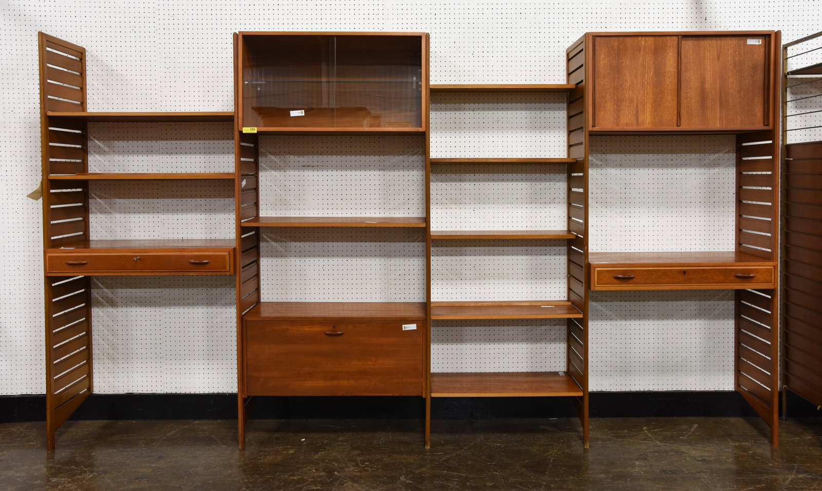 4 Bay Mid Century Wall Unit / System By Ladderax: 4 Bay Danish Modern Style Mid Century Modern Wall Unit / System by Ladderax - Consists of 5 Wood Sides, 8 Shelves, 1 Drop Down Cocktail Box, 2 Sliding Door Boxes, 2 Single Drawer Desk & 1 Key - 79 in 