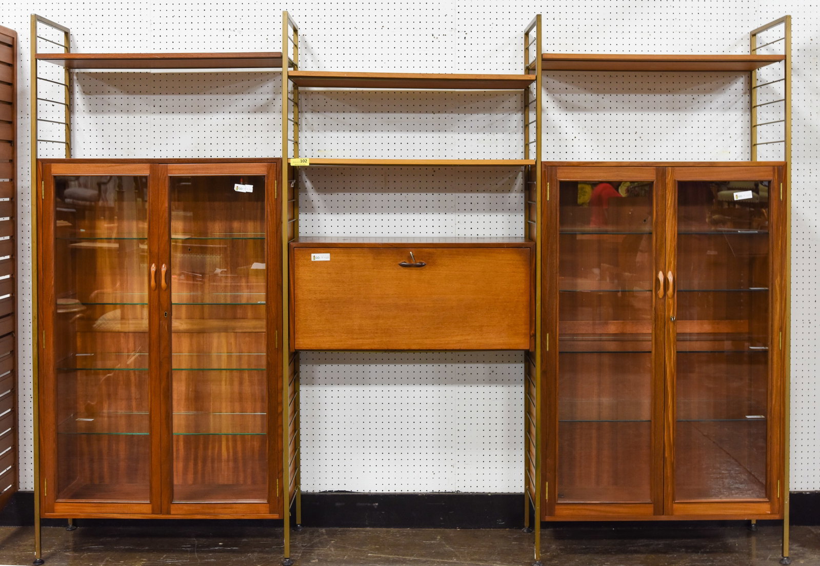 3 Bay Mid Century Wall Unit / System by Ladderax: 3 Bay Danish Modern Style Mid Century Modern Wall Unit / System by Ladderax - Consists of 4 metal sides, 4 shelves, 1 drop down cocktail , 2 large glass display boxes and 1 key - 79 in tall x 108 x 15