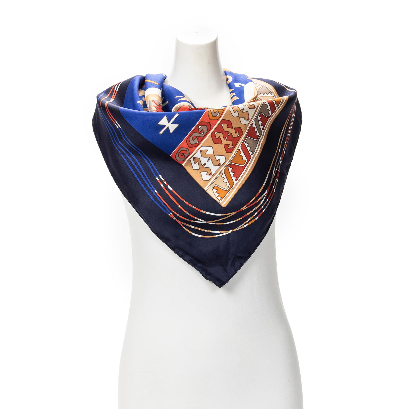 Hermes Scarf- Kilim by Dimitri Rybaltchenko: Genuine Pre-Owned Hermes Scarf in Navy/White/Brown 100% Twill Silk in A condition. Pattern / Title is Kilim by Dimitri Rybaltchenko Measurements: 90*90cm (Length * Height * Width). This lot includes