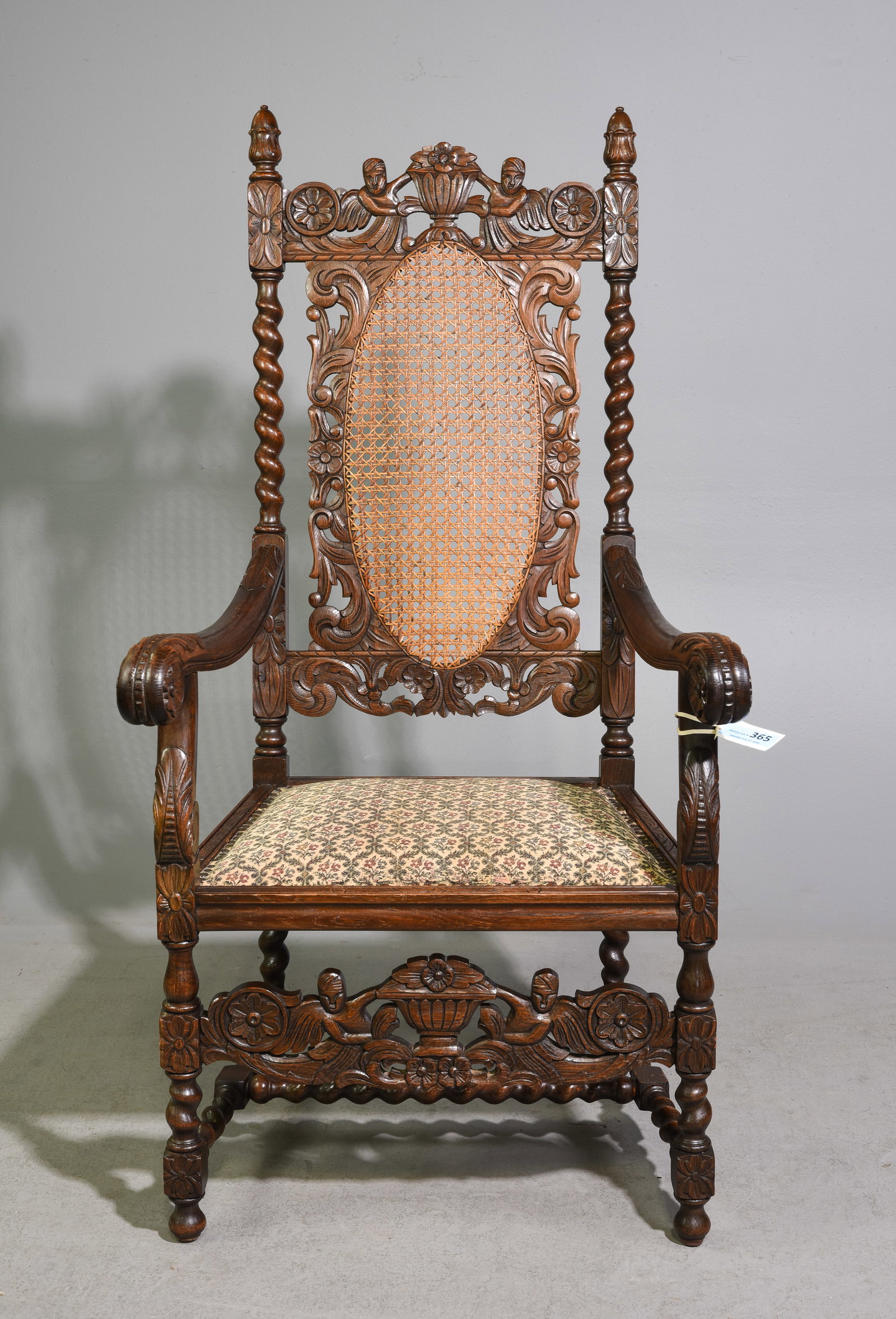 Danish Renaissance Style Carved Oak Arm Chair: Danish Renaissance Style Carved Oak Arm Chair with Caned Back - 52.5 in tall x 27 x 25 with a seat height of 18.5 inches