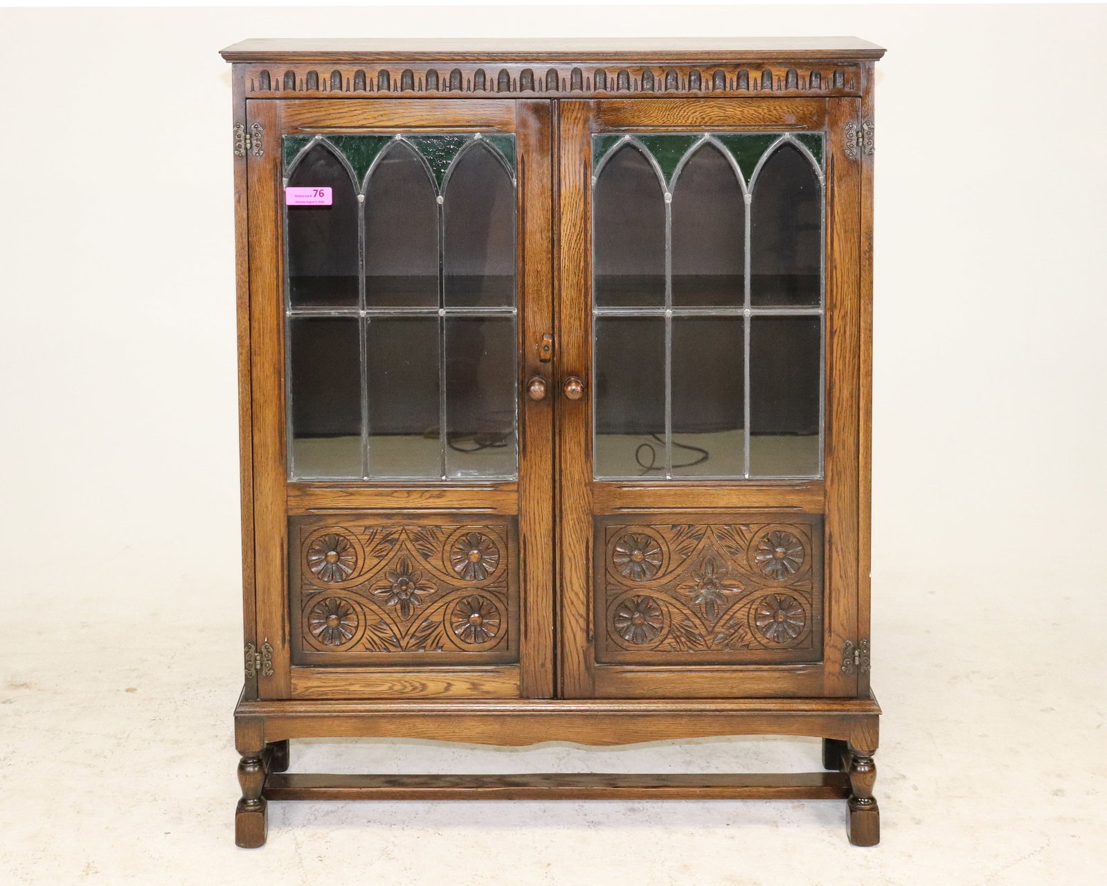 British Oak Leaded Glass Bookcase: British Oak Leaded Glass Bookcase that is 47 in tall x 38 in x 11 in.