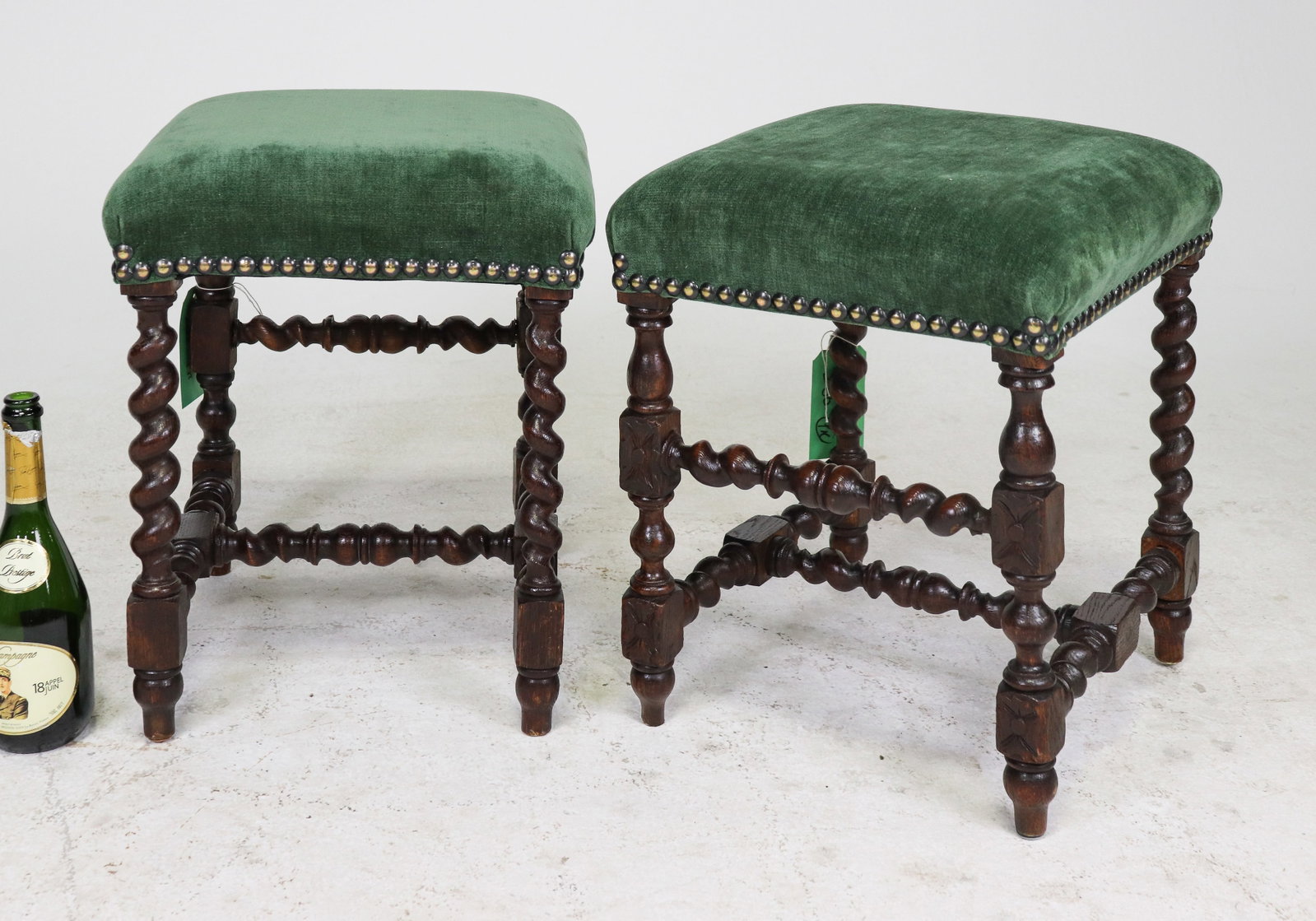 Pair Green Upholstered Barely Twist Footrests: Pair of green upholstered barley twist footrests that are each 19.5 in tall x 16.5 in x 16 in.