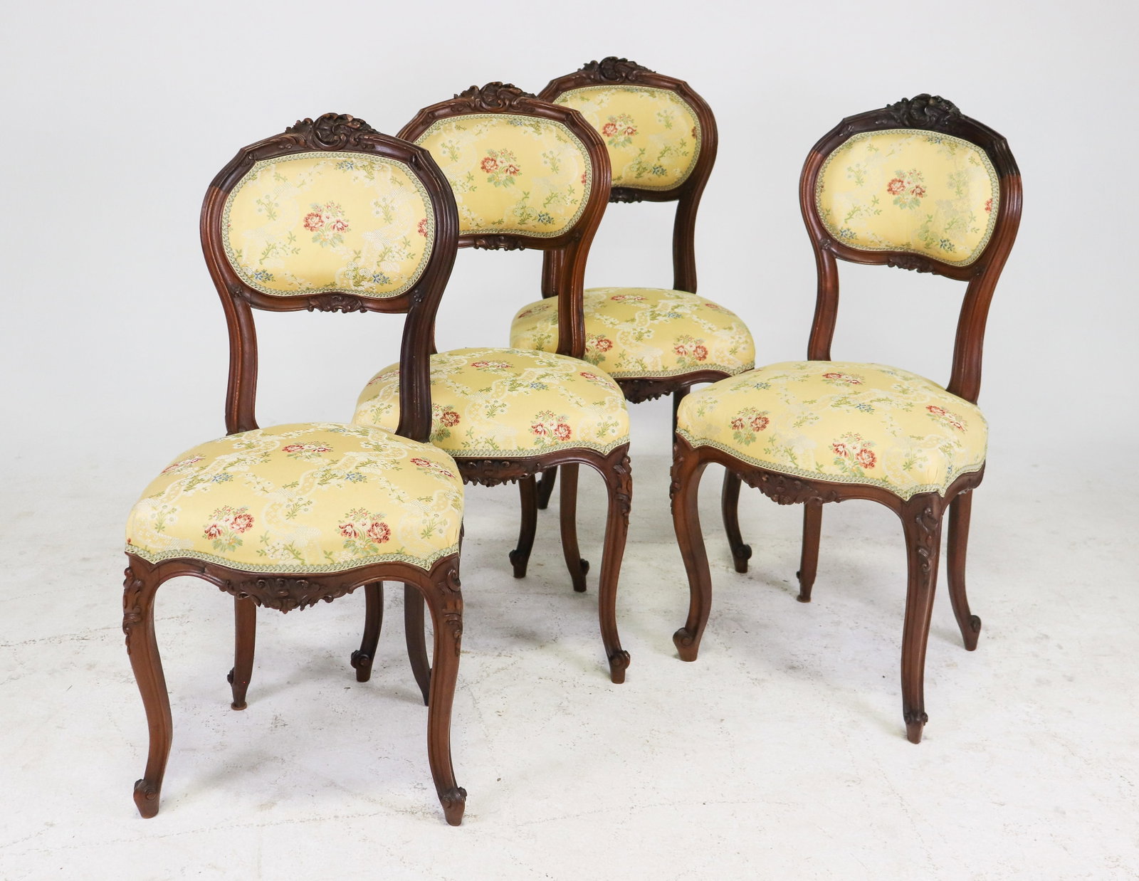 Louis XV Style Walnut Dining Chairs Set of 4: Set of 4 Louis XV style walnut dining chairs with new yellow floral upholstery. Dining Chairs measure 35.75 in tall x 17 in x 18 in and seat height 18.5 in.