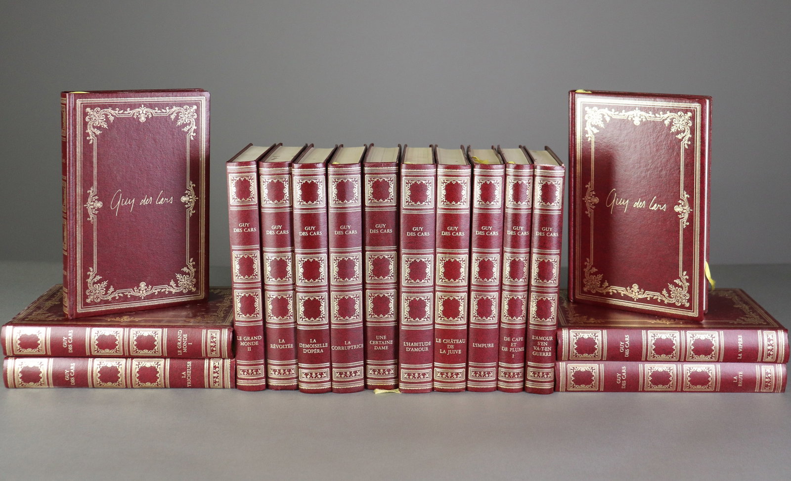 16 Red Hardback European Books: 16 Red Hardback European books featuring Guy Des Cars. Each book measures 7.75 in tall x 5 in x 1 in.