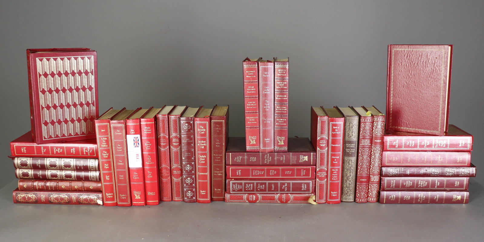 35 Red Leatherbound European Novels/Books: 35 Red leatherbound British, French and European novels/books. Each book measures 8 in tall x 5.75 in x 1.25 in.