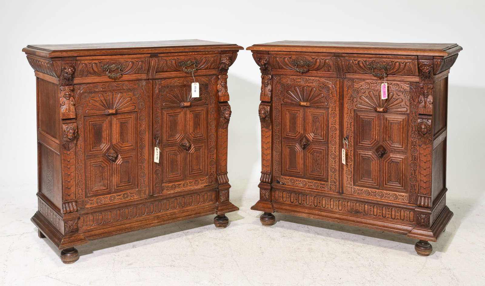 2 Renaissance Style Carved Oak Buffets: 2 French Henri II / Renaissance Style Carved Oak Buffets / Sideboards featuring Lion Heads - 42.25 in tall x 43 x 19.25 each
