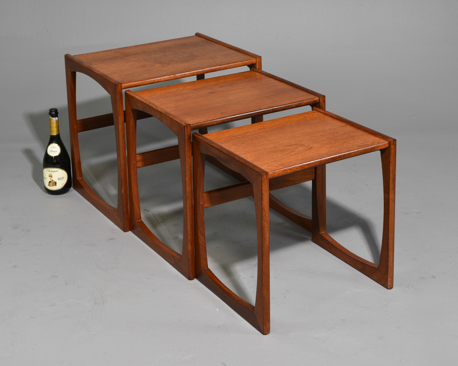Mid Century Modern Quadrille Nest of 3 Tables: This Danish Modern Style Nest is British and made by Mid Century Modern Furniture Maker G Plan ( Gplan ) it stacks to make a bookcase as well. - 19.25 in tall x 21 x 17, 18 in tall x 19 x 15.25 and